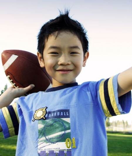 A boy throwing a football